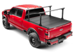 Red pickup truck with BAKFlip MX4 TS tonneau cover installed. View includes racks (not included) to show functionality of T Slots. 