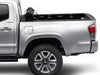 Side profile of truck with tonneau cover fully rolled up. 