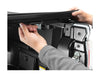 Image of a hand pulling security latch on tonneau cover. 