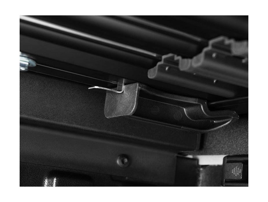 Inside view of locking system for a tonneau cover. Shows latching mechanism. 