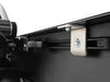 Inside rail view of open tonneau cover with attachment system exposed. 