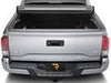 Back view of truck with fully rolled up tonneau cover. 