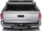 Back view of truck with fully rolled up tonneau cover. 